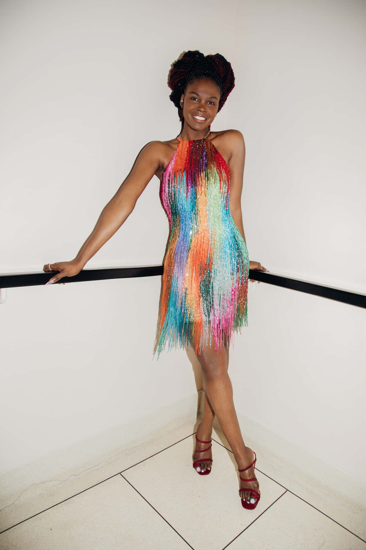 A Woman In A Colorful Dress Posing For A Photo