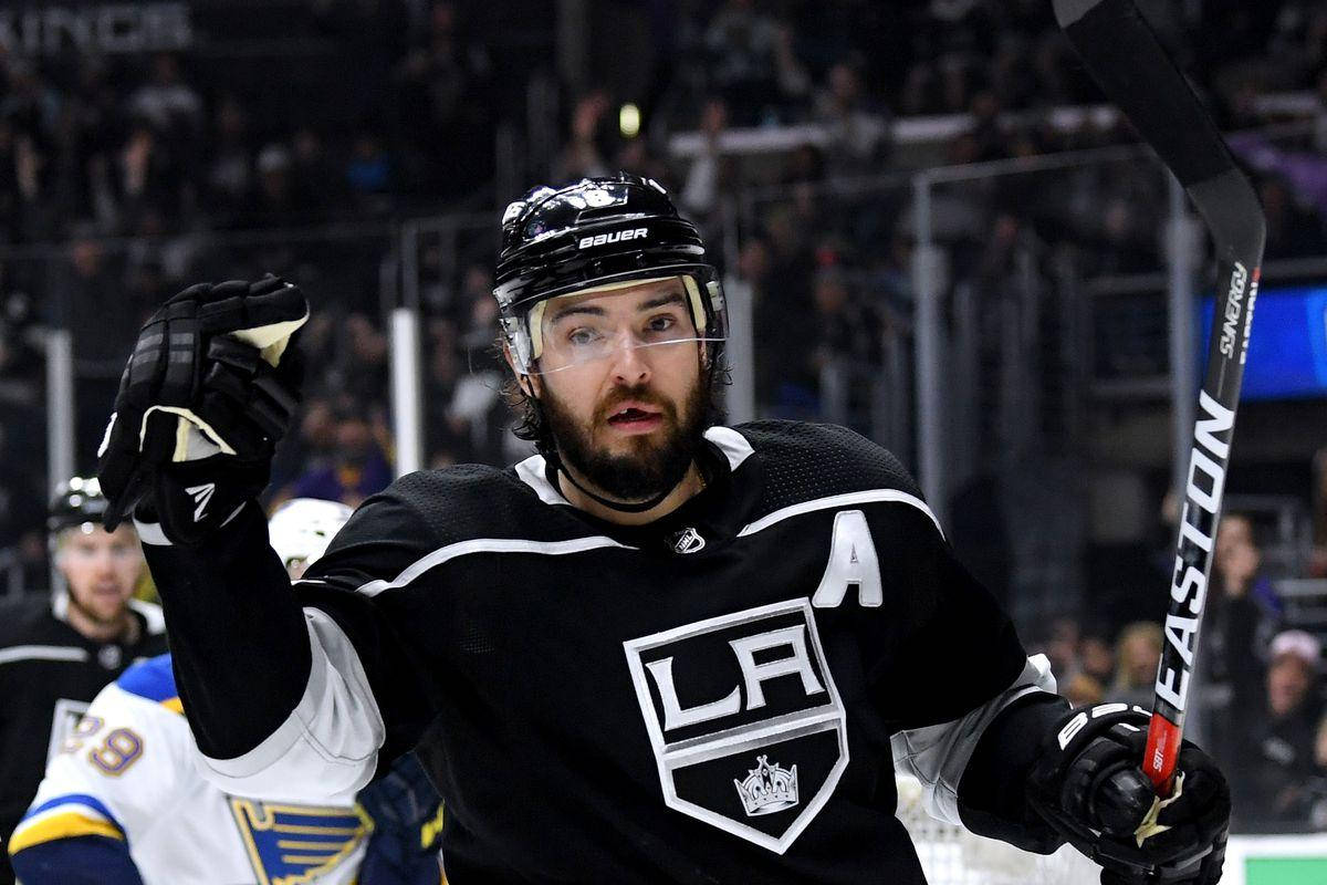 Drew Doughty Giving A Signal During Game While Holding Hockey Stick Wallpaper