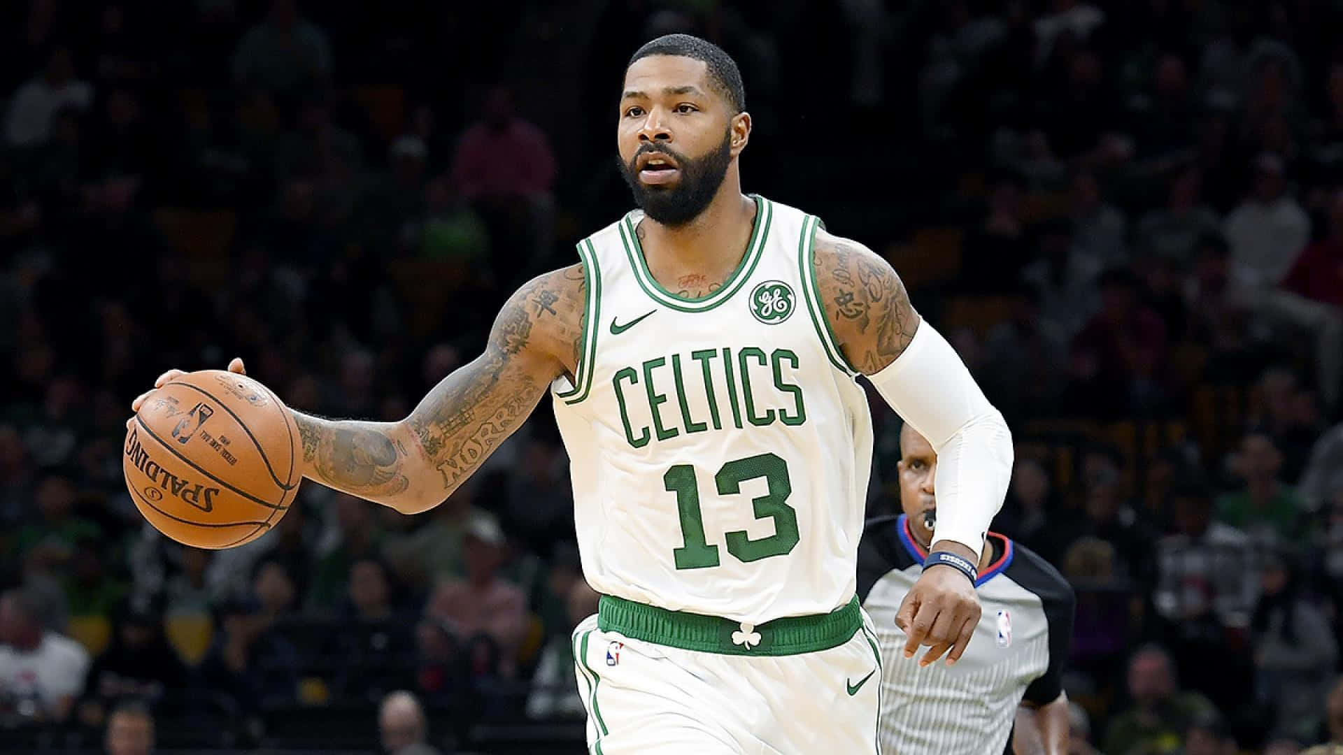 Dribbling Boston Celtics Power Forward Marcus Morris Wallpaper