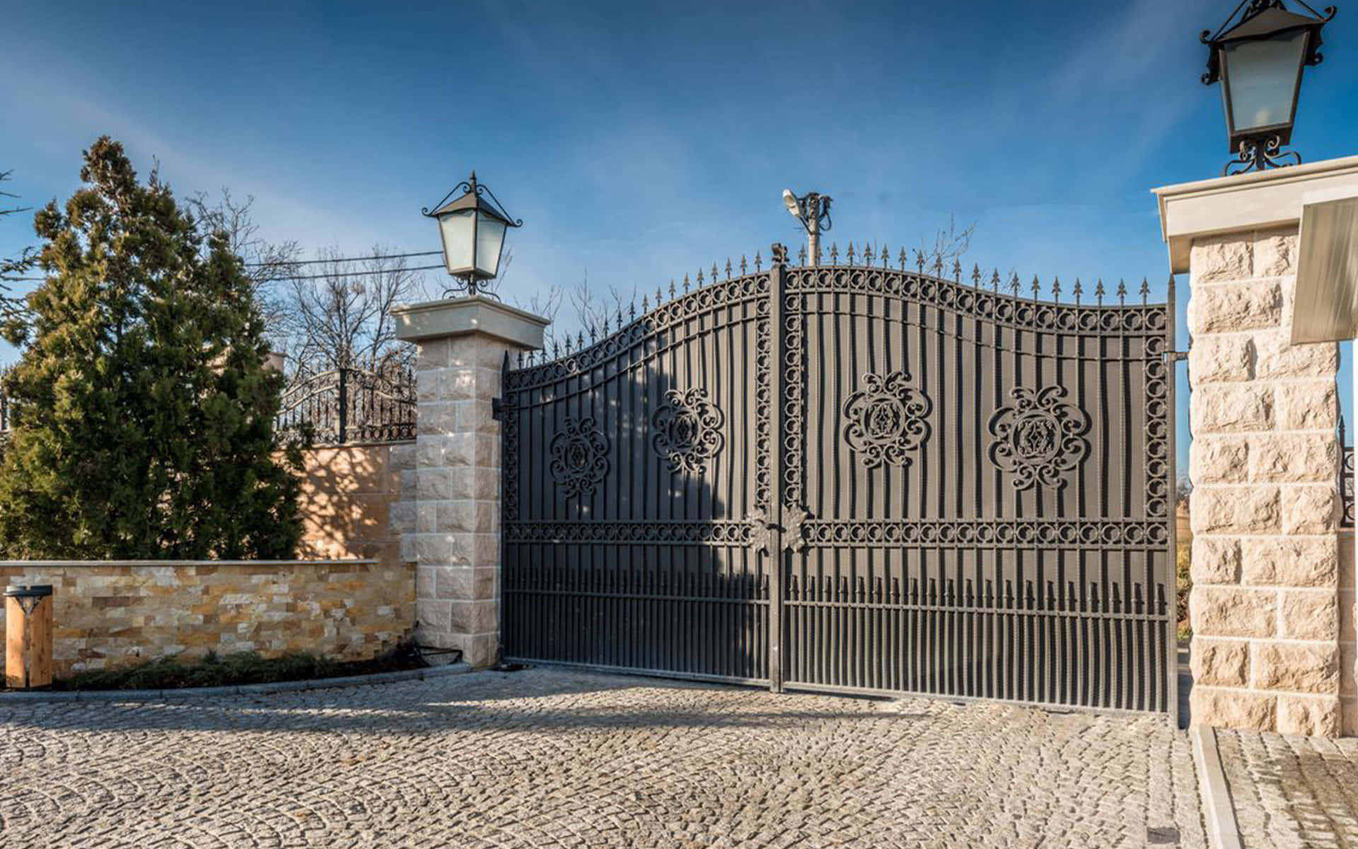 A Large Gate With A Lamp And Lights