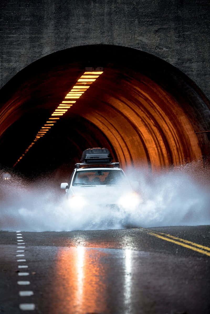 Driving Through Wet Tunnel Wallpaper