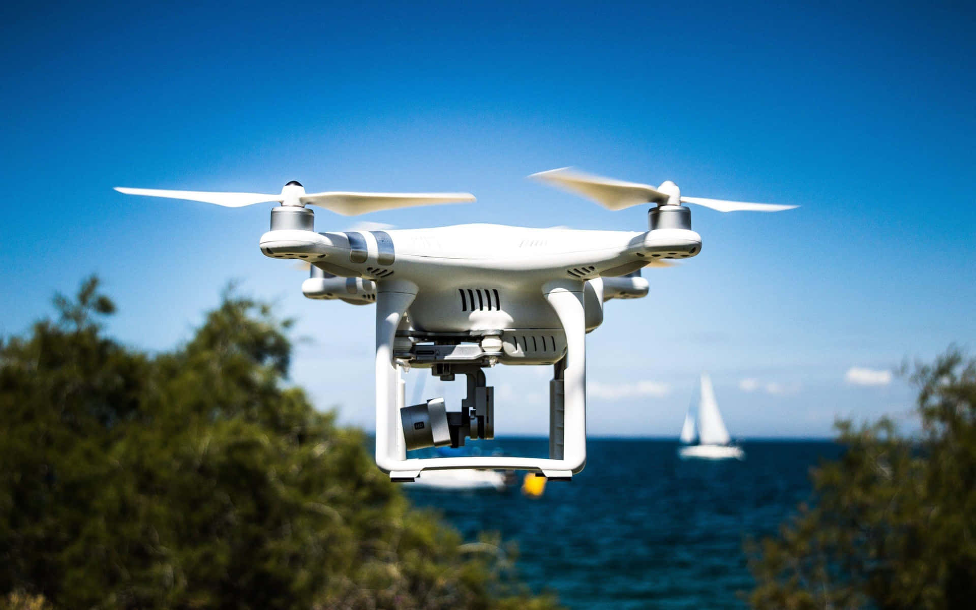 Drone In Flight Over Coastal Waters Wallpaper