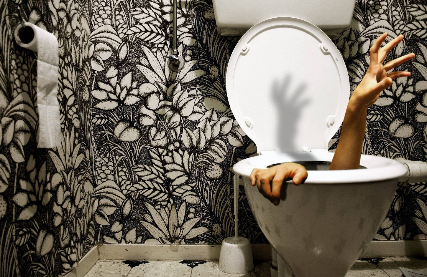 Caption: Unusual Perspective of Modern Toilet Bowl Wallpaper