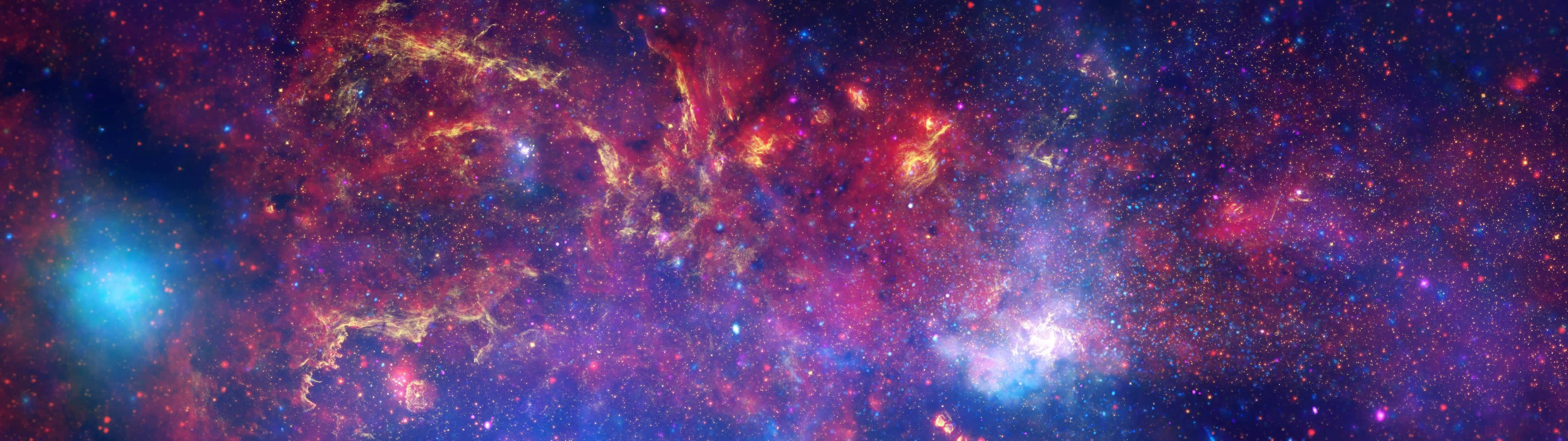 Et farverigt rum med stjerner og nebulaer Wallpaper