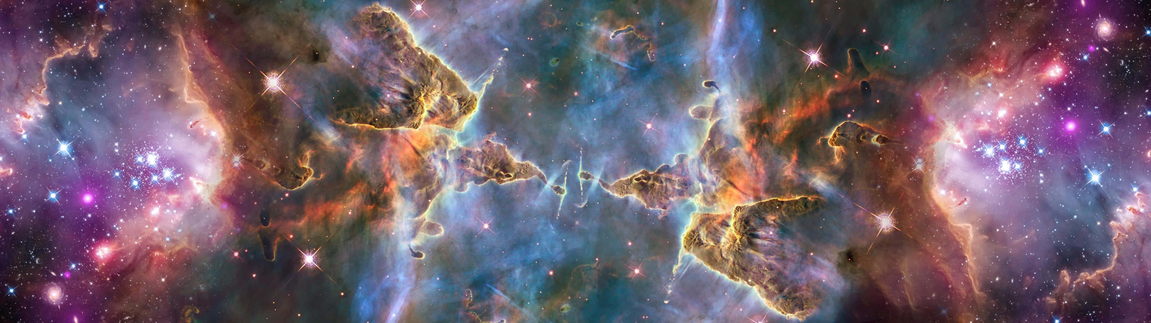 En rumscene med stjerner og nebulaer. Wallpaper