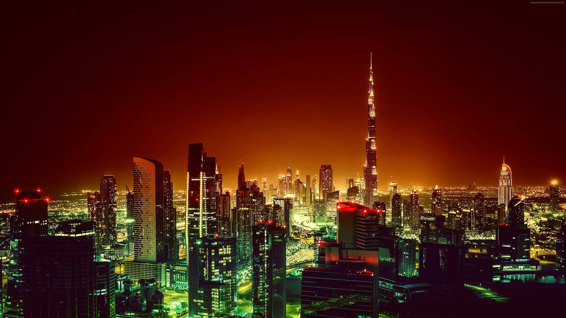 Majestic View of Dubai Glowing in Red at Night Wallpaper