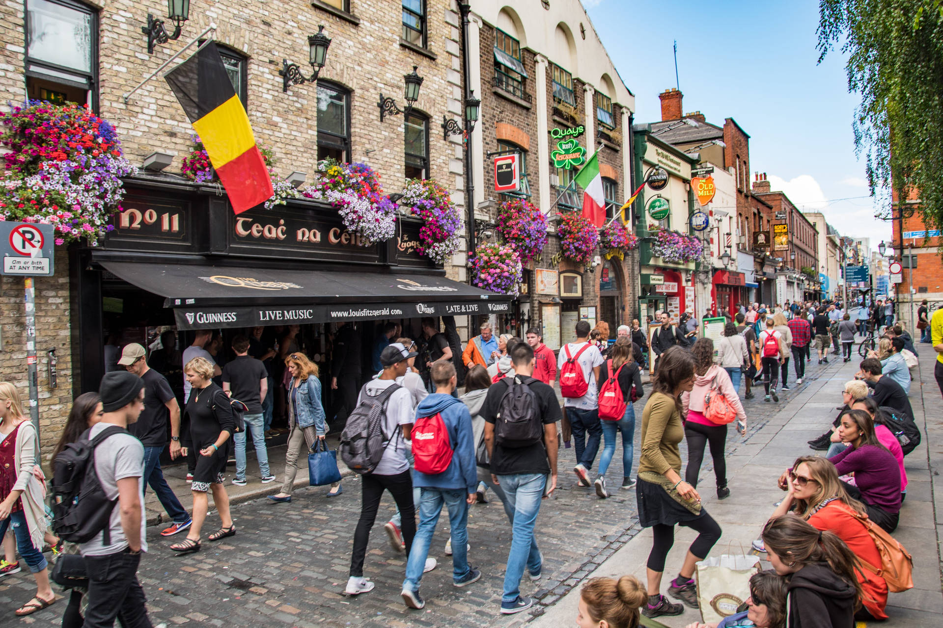 Caption: Vibrant Scene of a Busy Street in Dublin Wallpaper