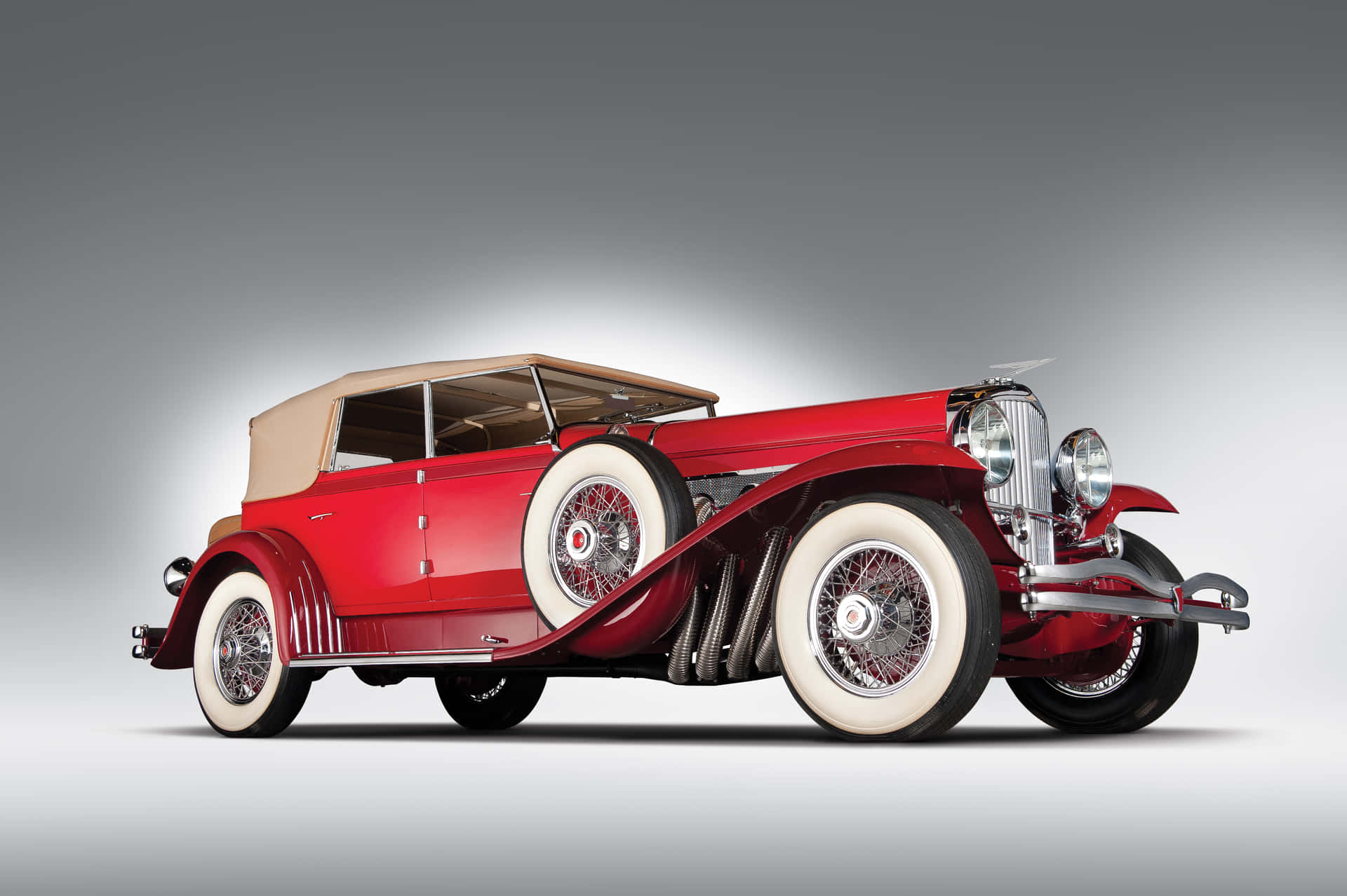 Majestic Duesenberg Model J - The Epitome of Vintage Luxury Cars Wallpaper