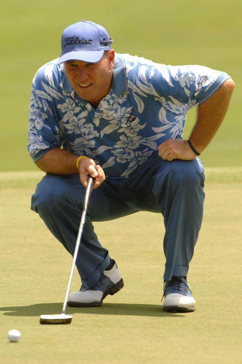 PGA Pro Duffy Waldorf Analyzing His Golf Ball Placement Wallpaper