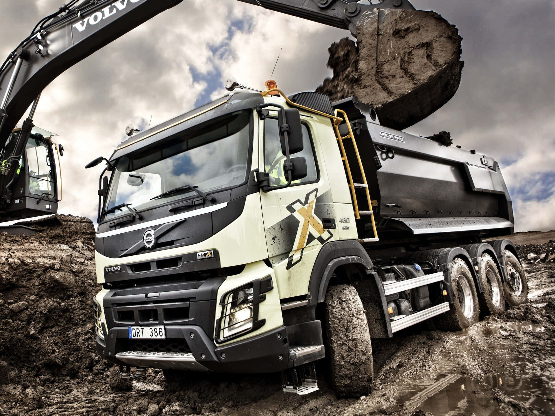 A Large Truck Is Digging In The Dirt