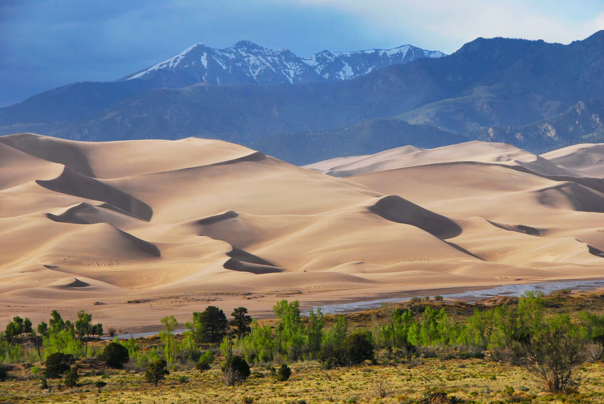 A sand dune seen in a surreal desert landscape.