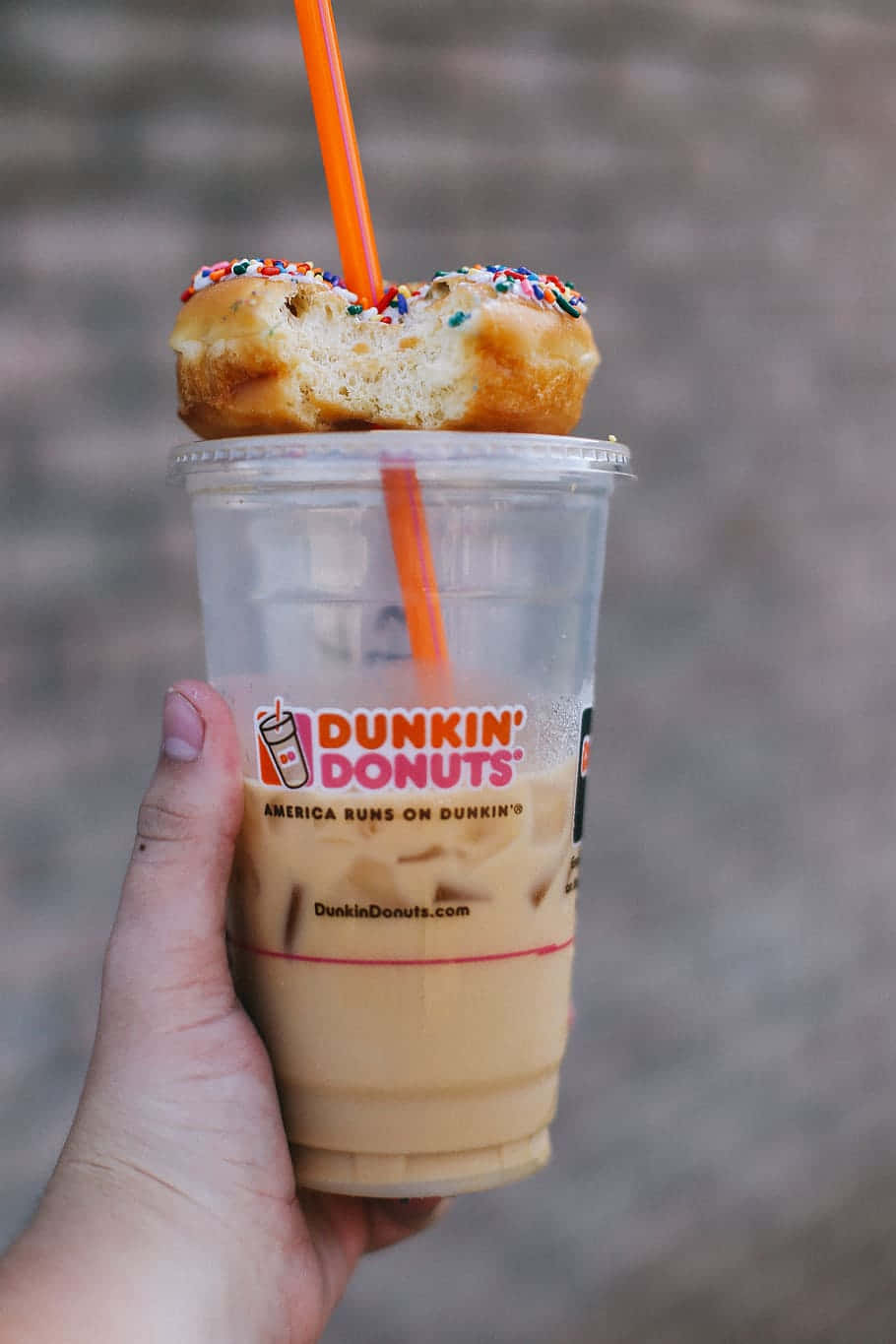 Enjoy a delicious latte from Dunkin' Donuts