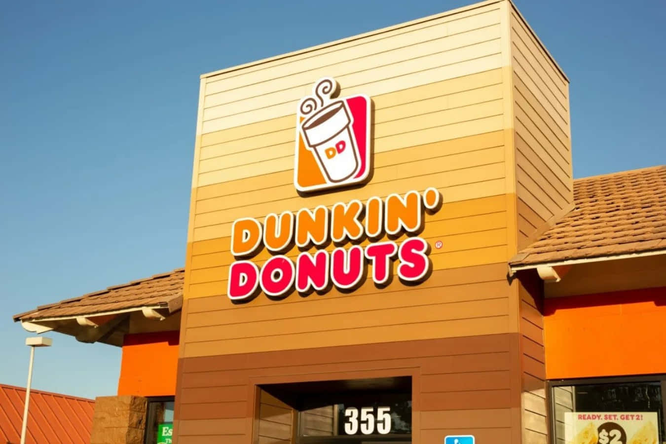 Enjoying a classic Dunkin’ Donuts coffee.
