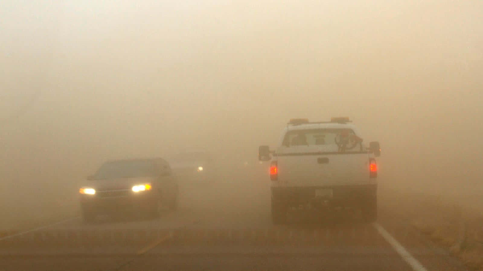 Dust Storm Impaired Visibilityon Road.jpg Wallpaper