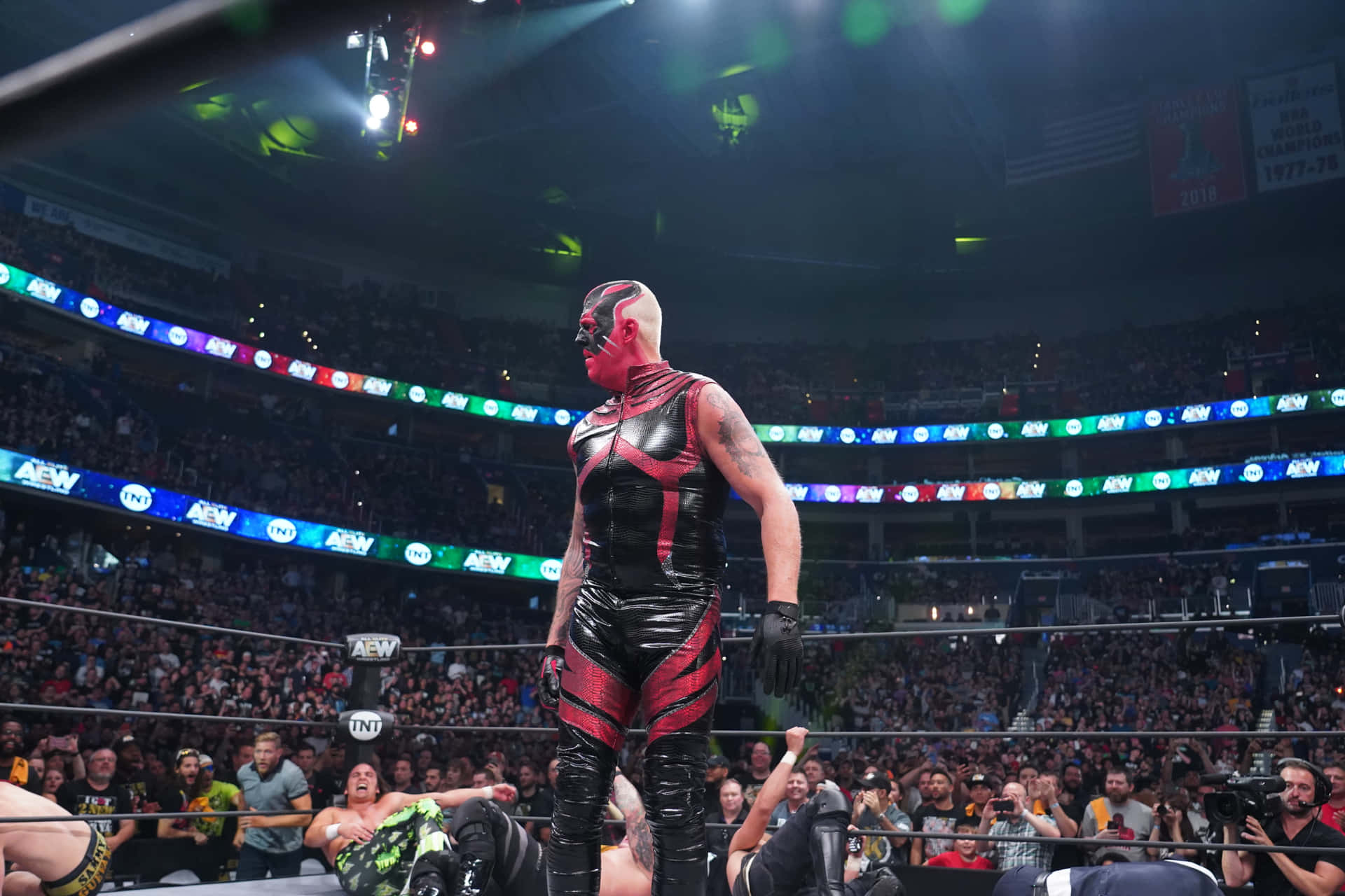 Dustin Rhodes in a wrestling face-off with Britt Baker Wallpaper