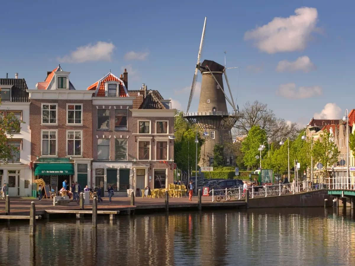 Dutch Canal Scenewith Windmill Wallpaper