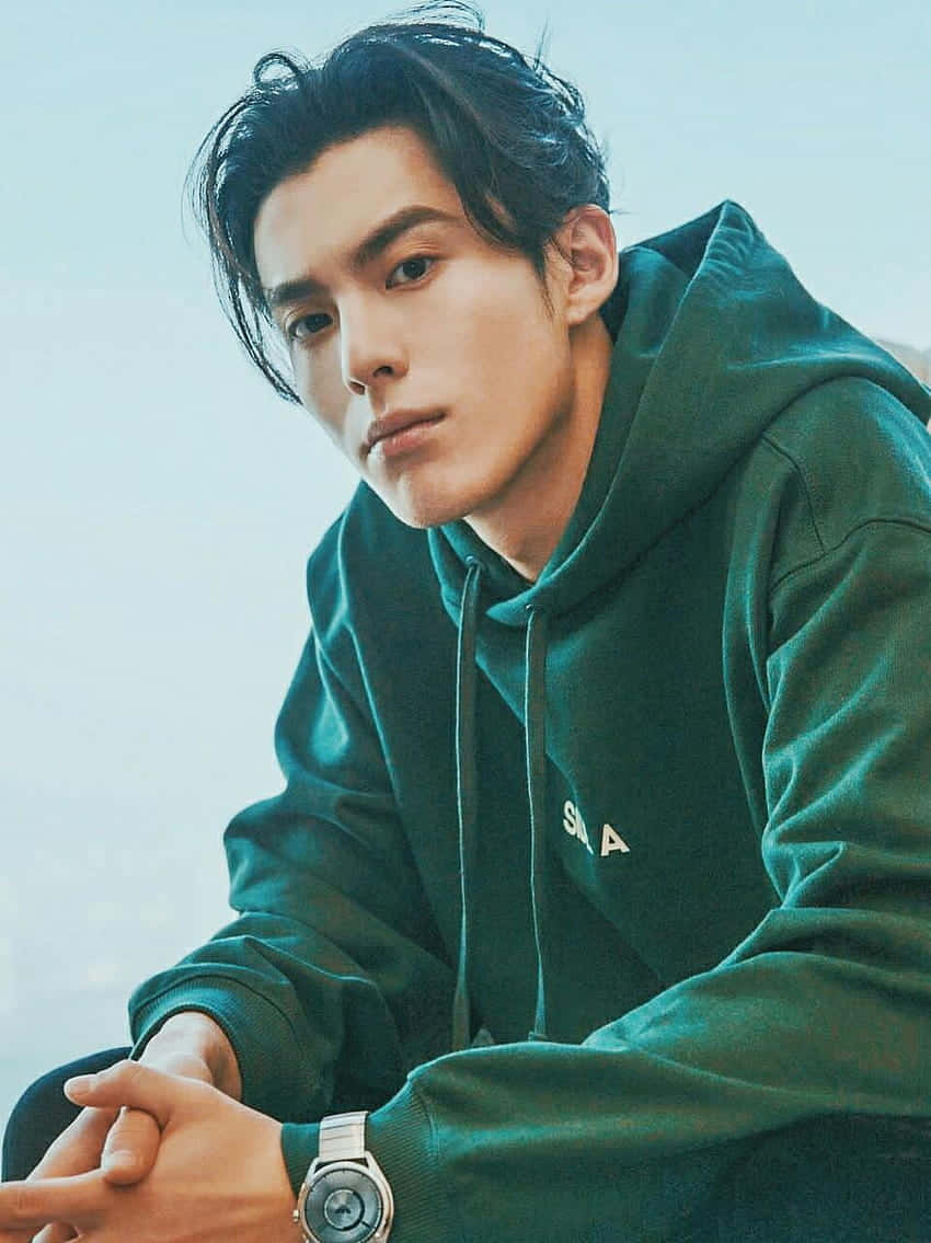 Dylan Wang Wearing A Green Hoodie Wallpaper