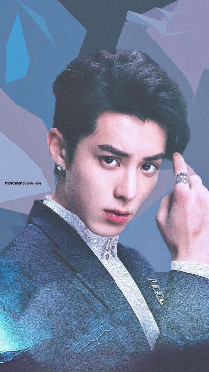 Dylan Wang Wearing A Blue Suit With Ring On His Finger Wallpaper