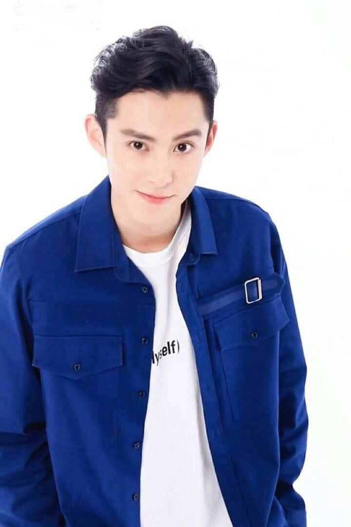 Dylan Wang Wearing A Blue Top Wallpaper