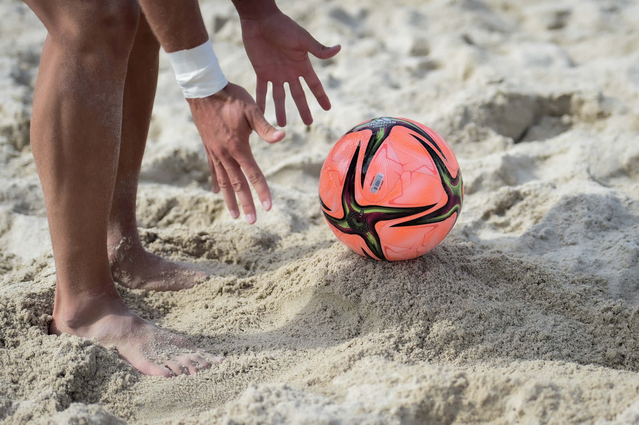 Dynamic Beach Soccer Match In Action Wallpaper