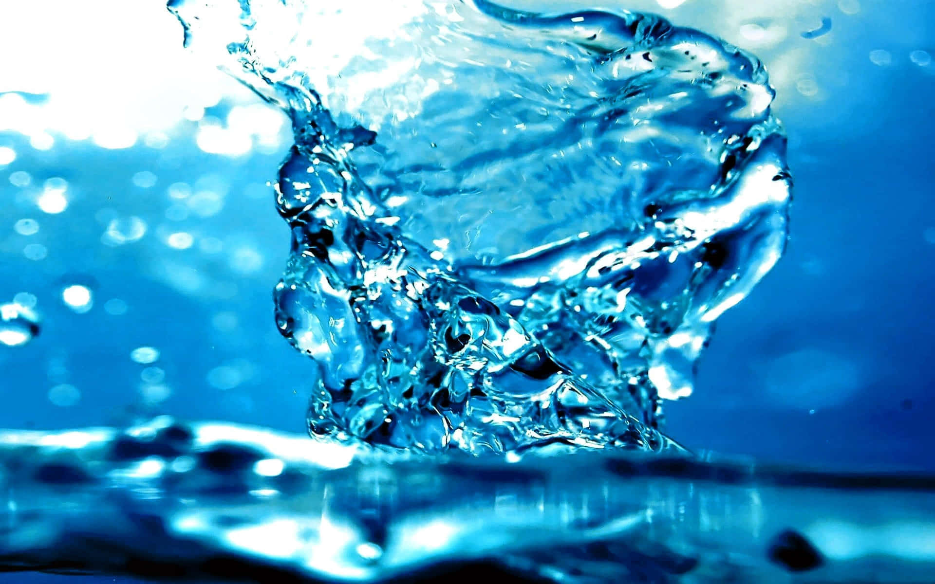 Dynamic_ Blue_ Water_ Splash Wallpaper