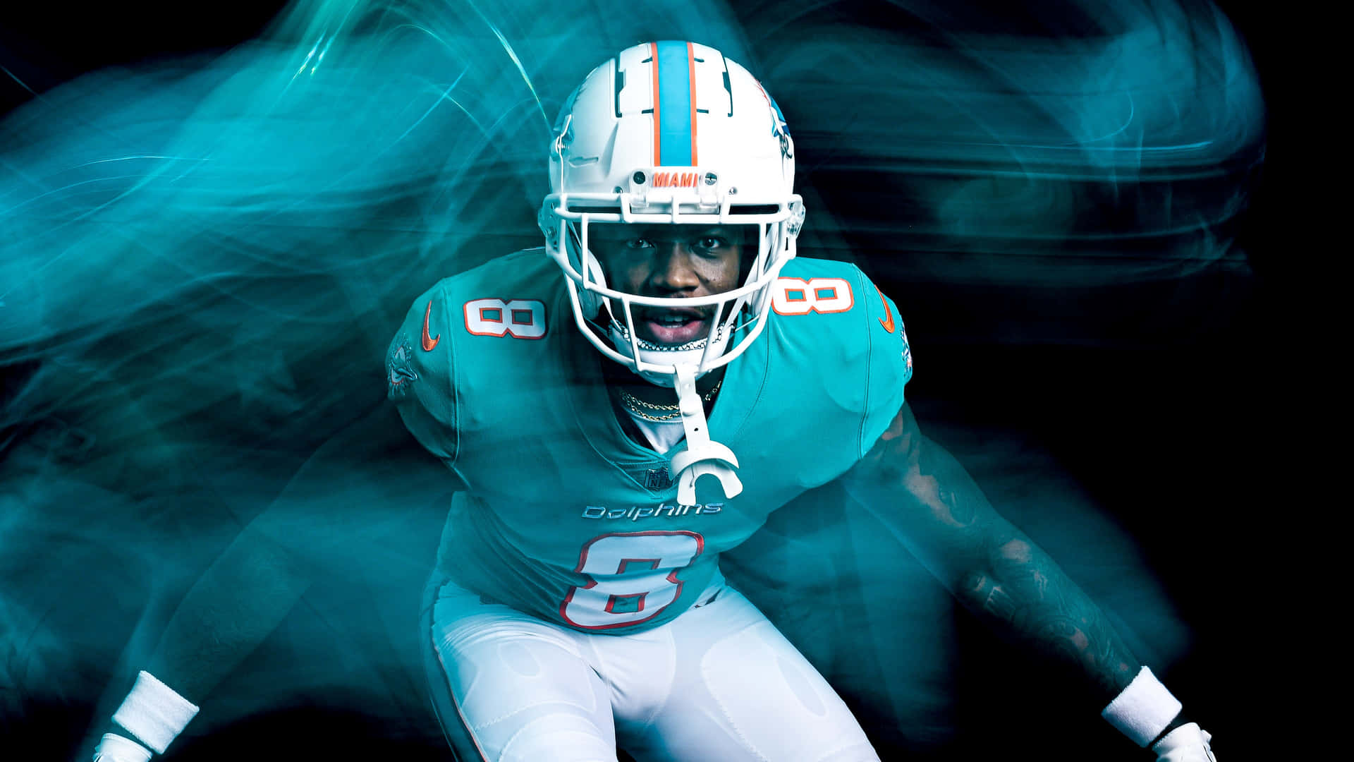 Dynamic Miami Dolphins Player Action Shot Wallpaper