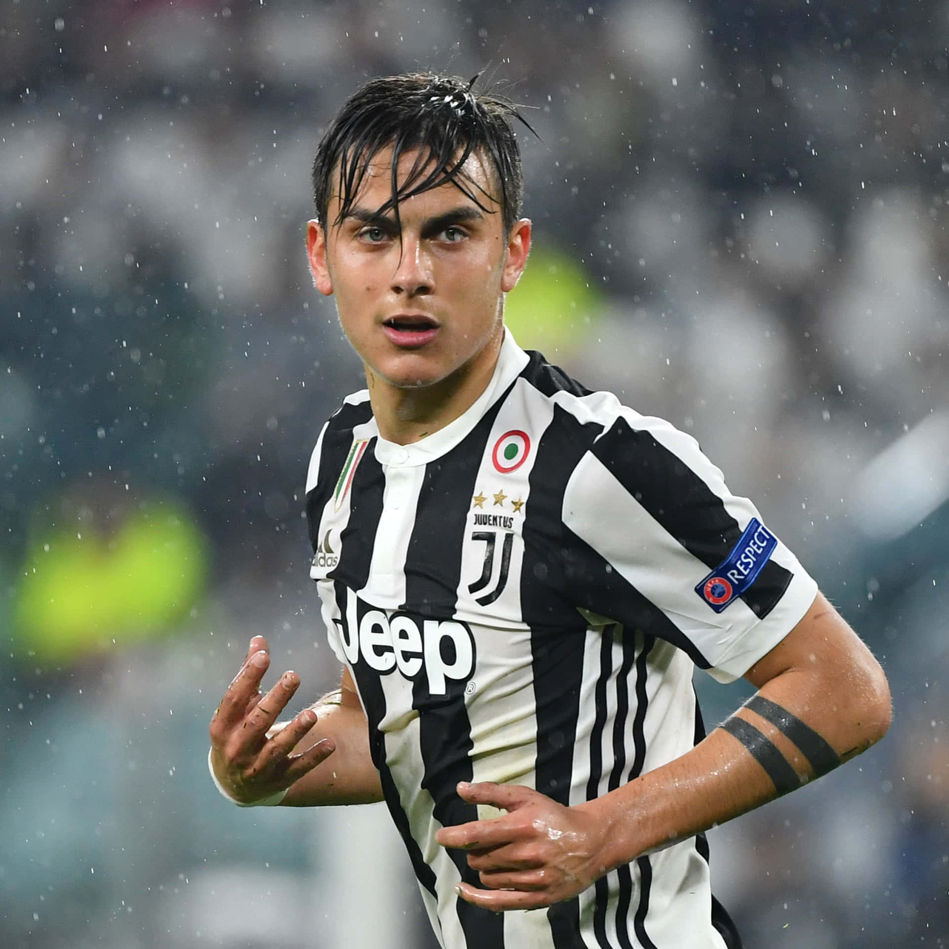 Dynamic Paulo Dybala During A Heated Match Wallpaper