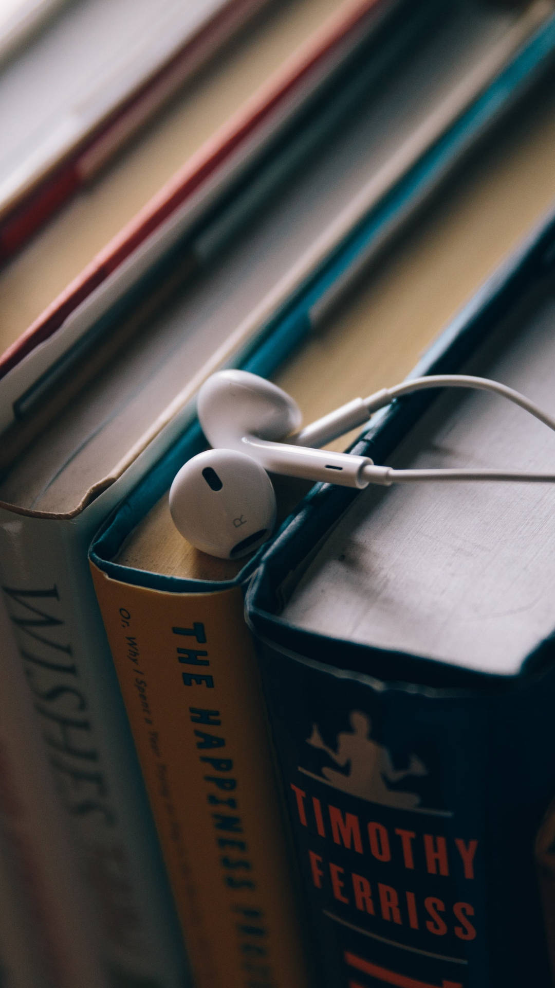 Earphones Placed Over The Books Wallpaper