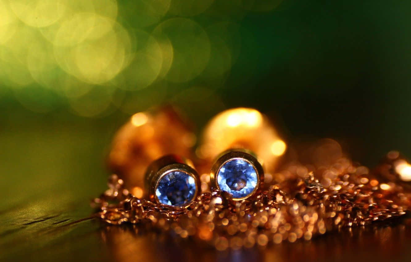 Blue Sapphire Stud Earrings On A Gold Background