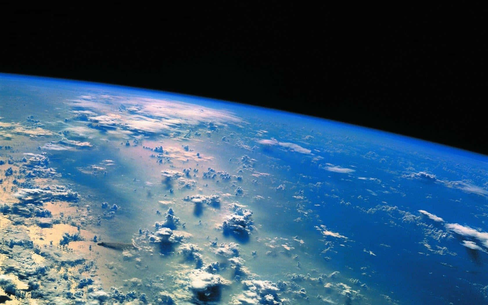 Elplaneta Tierra Visto Desde El Espacio Exterior. Fondo de pantalla