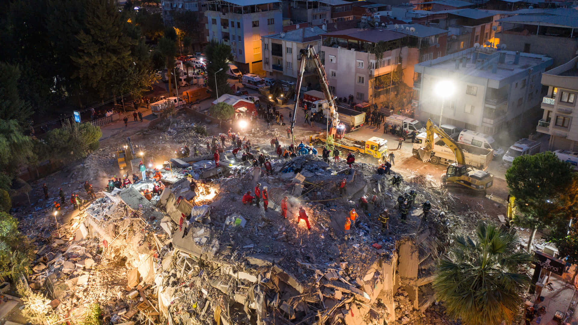 A Large Pile Of Rubble Is Seen In The Night