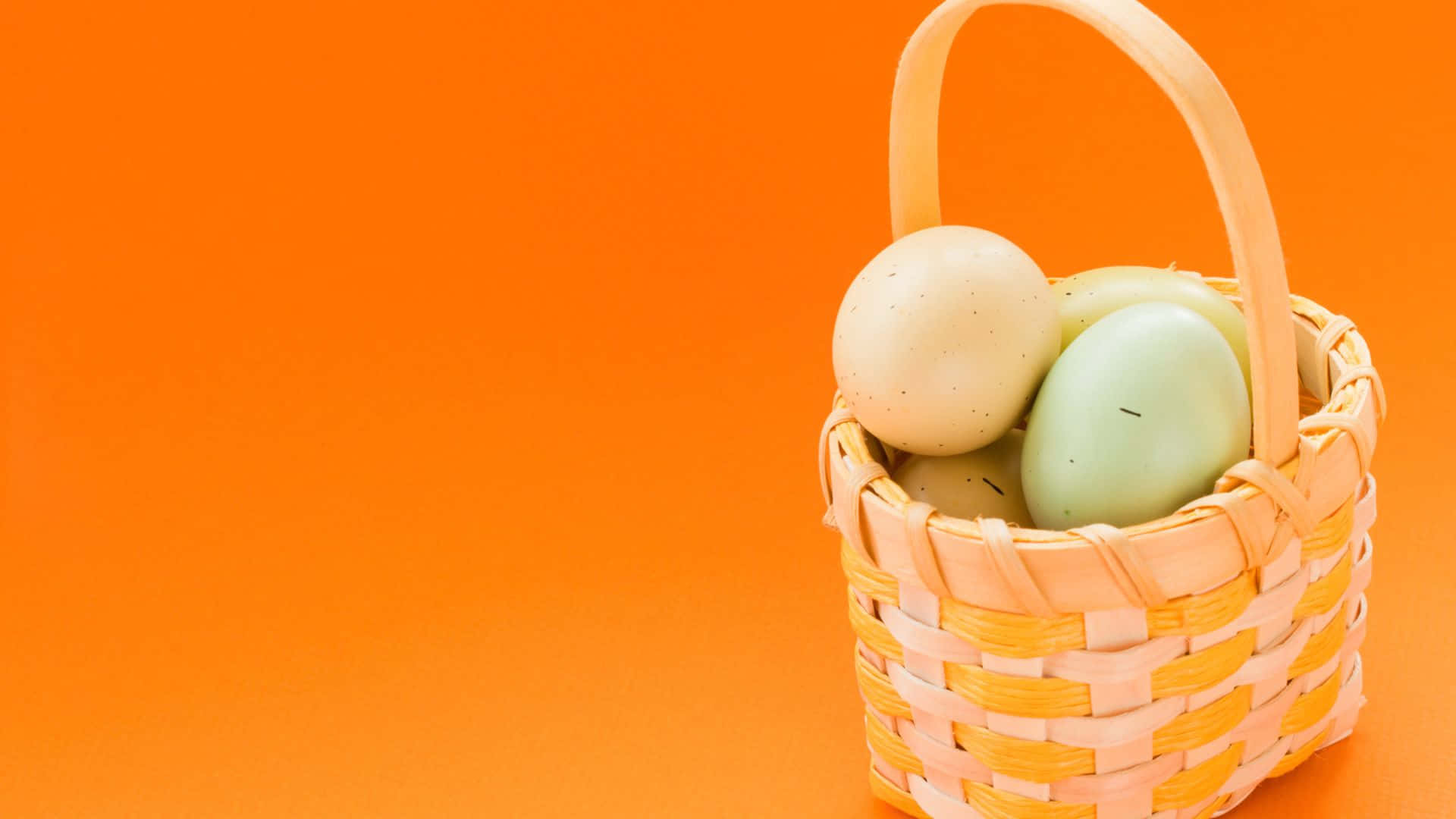 A Basket With Eggs In It On An Orange Background Wallpaper