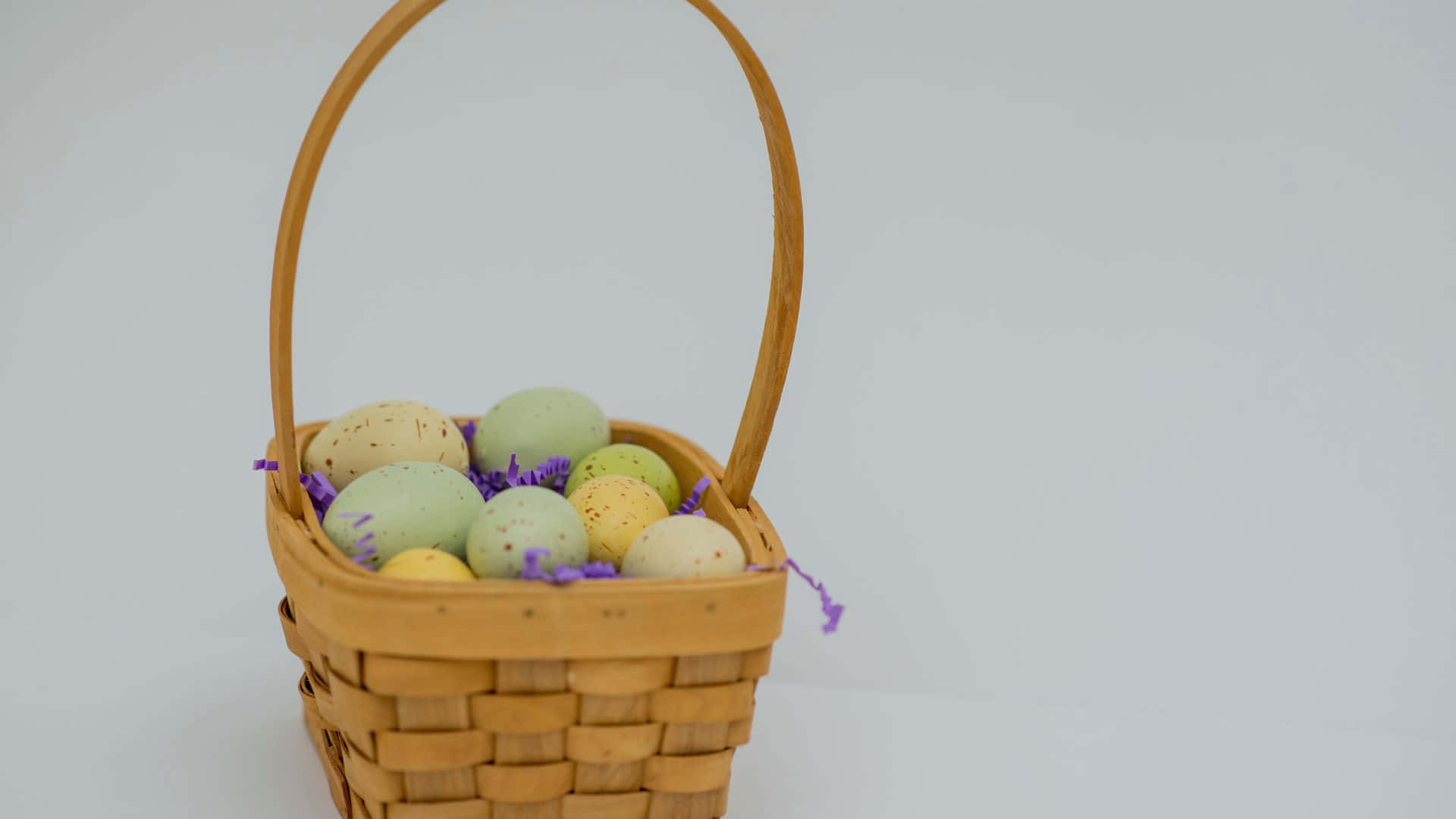 Colorful Easter Basket with Different Eggs Wallpaper