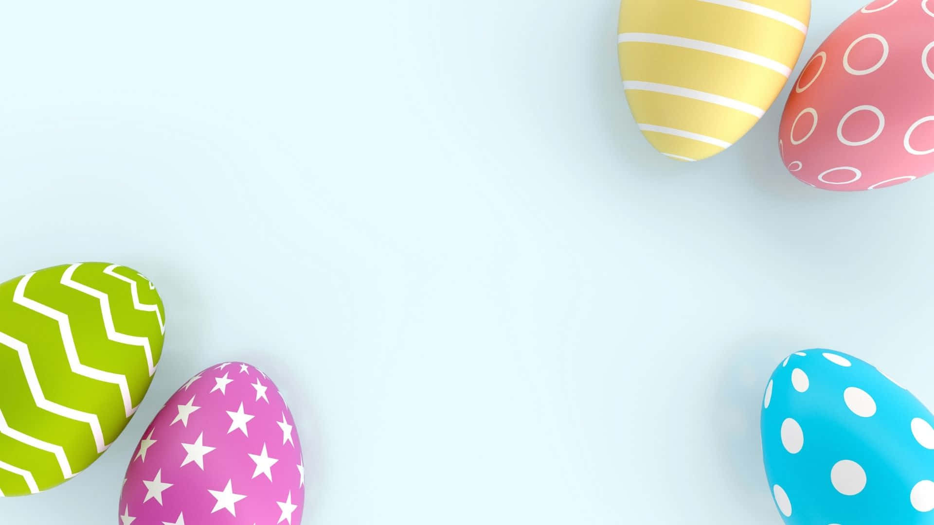 Colorful Easter eggs spilled across the grass Wallpaper