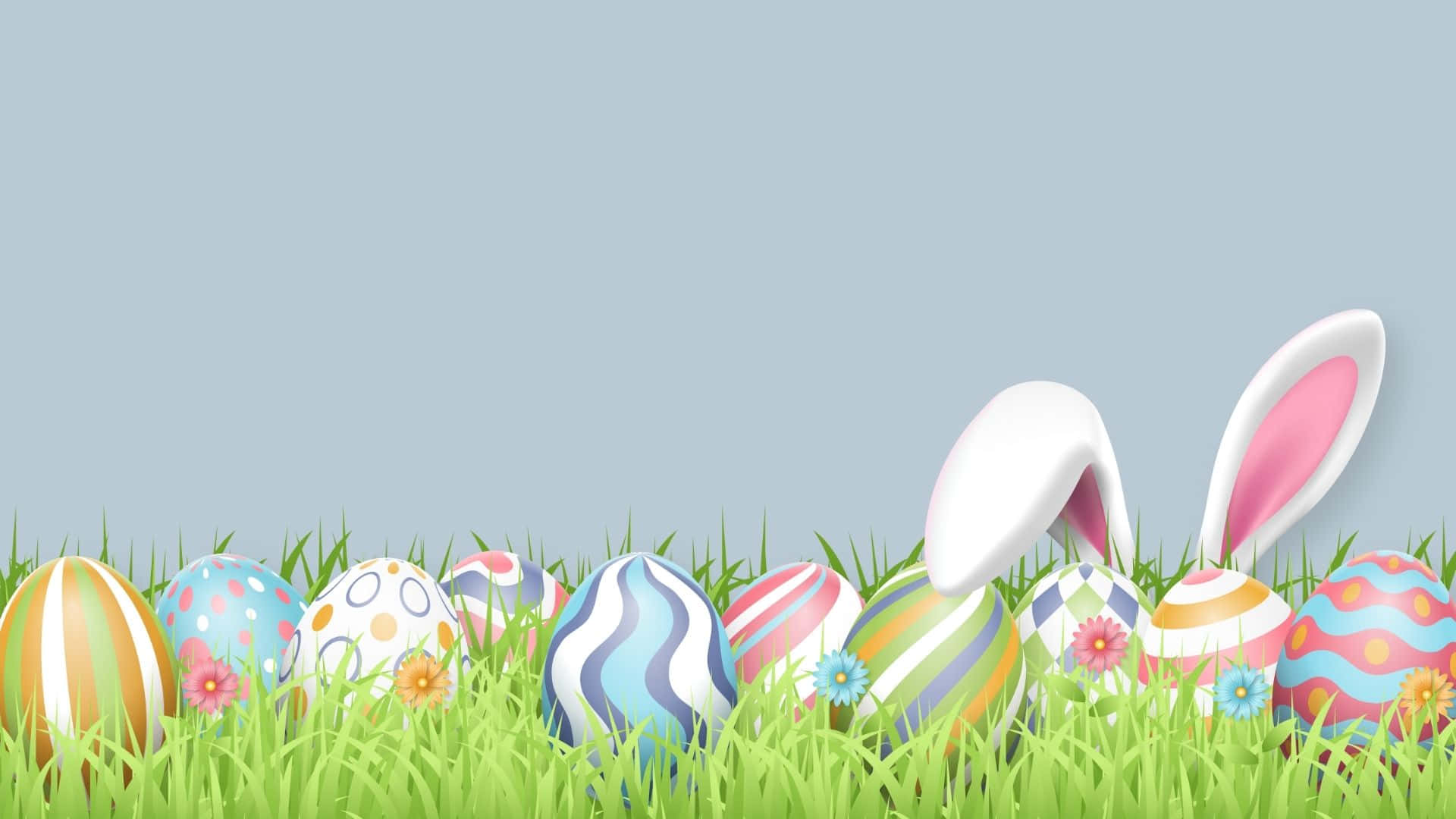 Easter Eggs In Grass With Bunny Ears Wallpaper