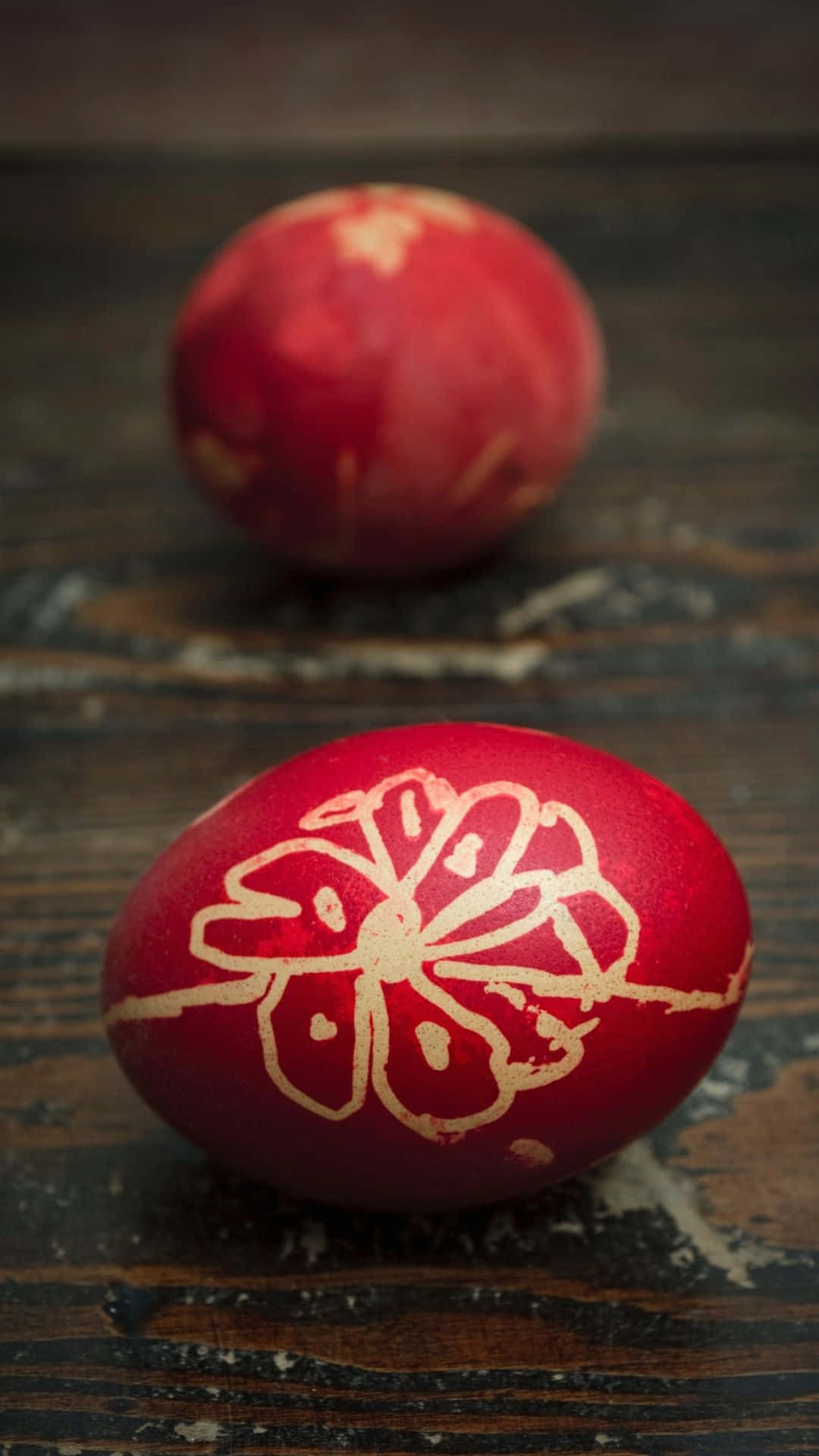 Two Red Eggs With A Flower On Them Wallpaper