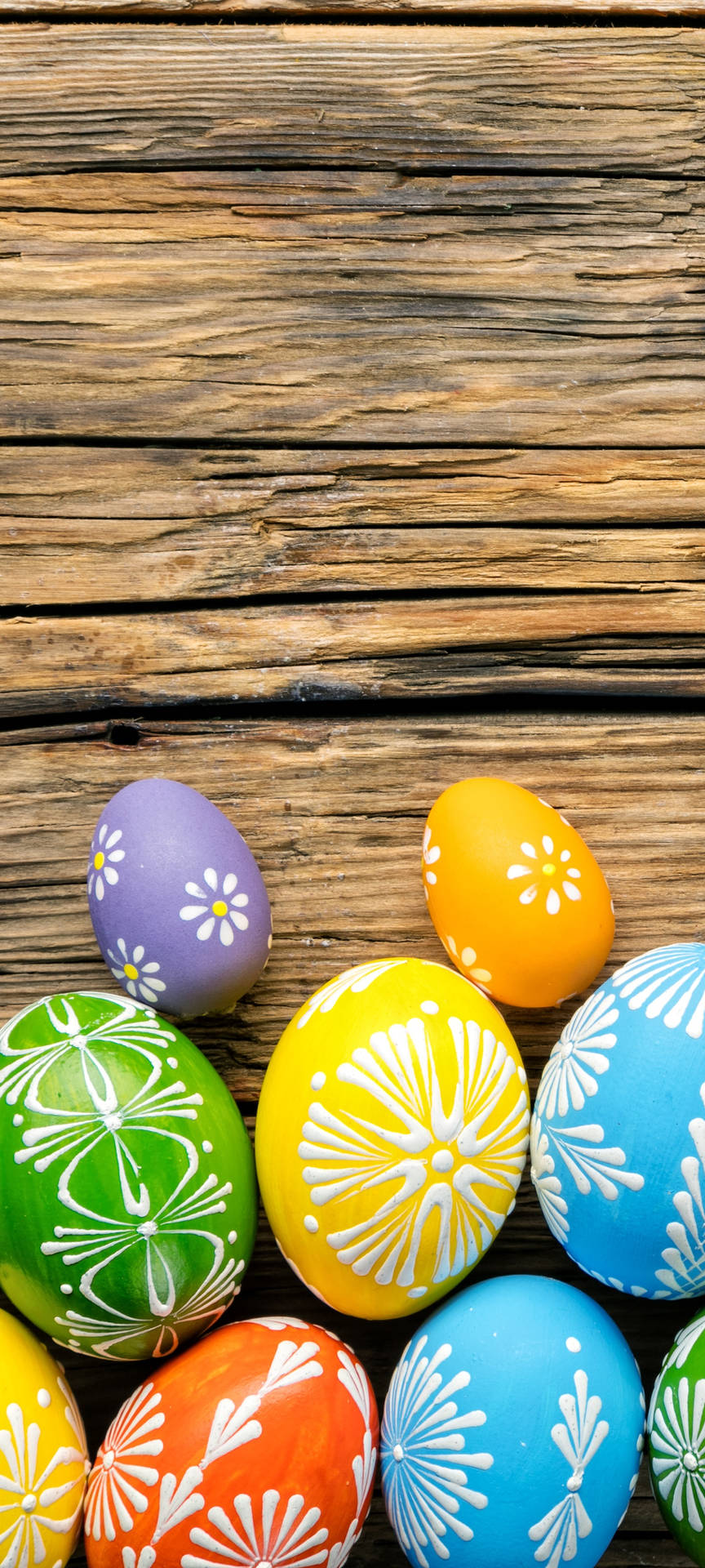 Colorful Easter Eggs On A Wooden Background Wallpaper