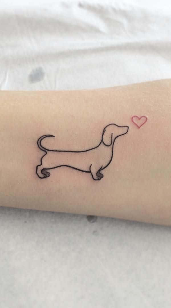 A Small Dachshund Tattoo With A Heart