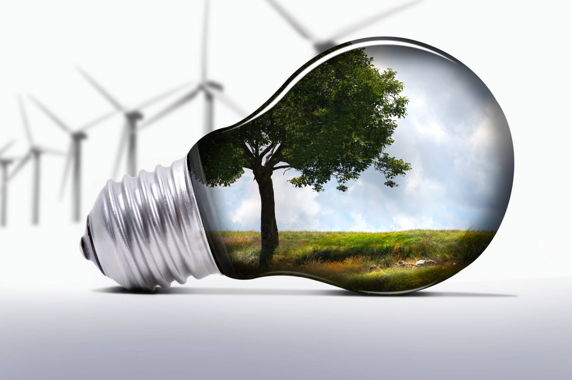 "Eco-Friendly Light Bulb Illuminated with Mini Windmills" Wallpaper