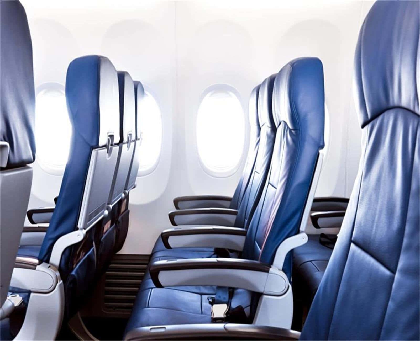 Wirtschaftsklasseblaue Sitze Im Inneren Des Flugzeugs. Wallpaper