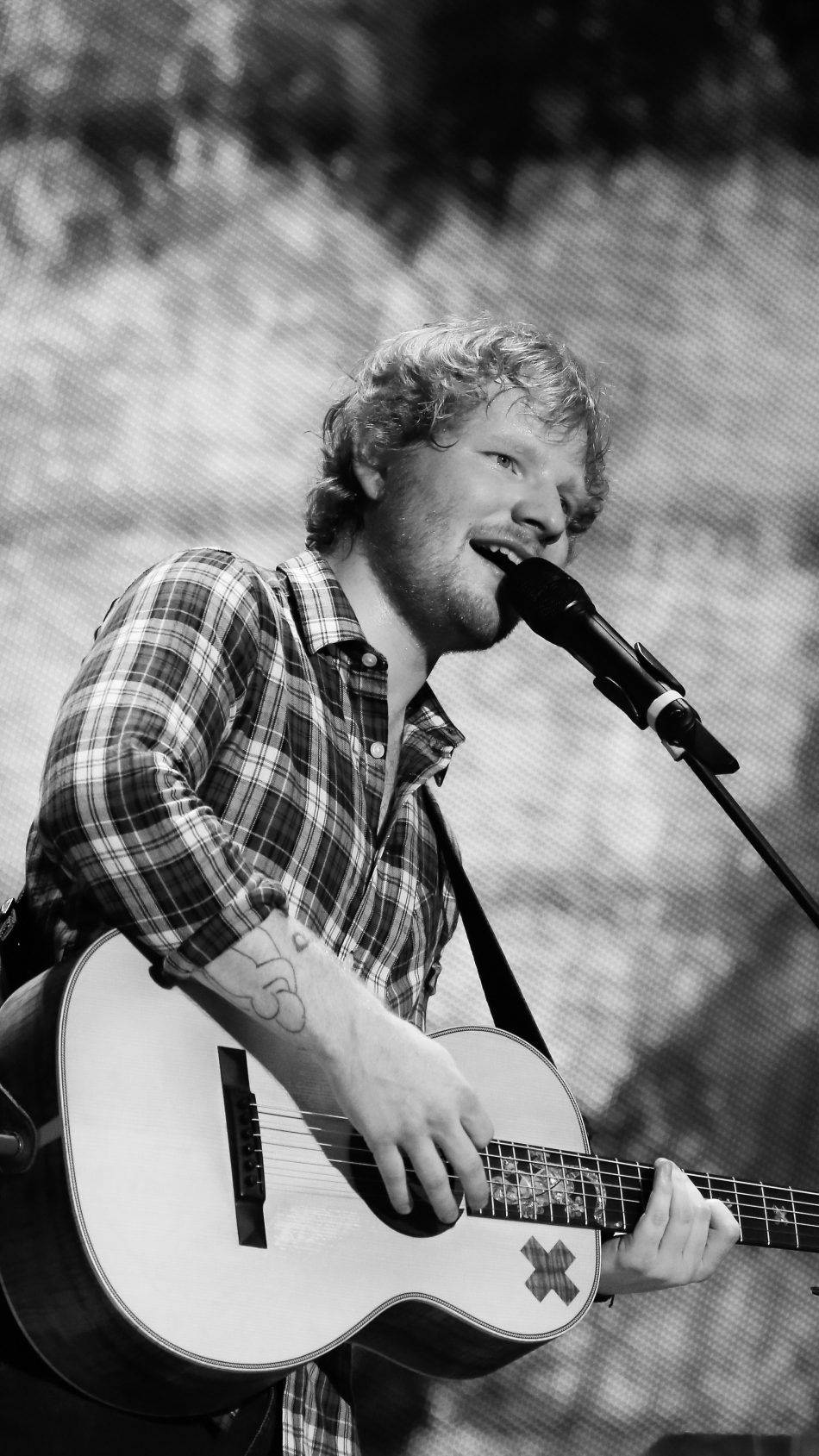 Ed Sheeran in a calming black and white image Wallpaper