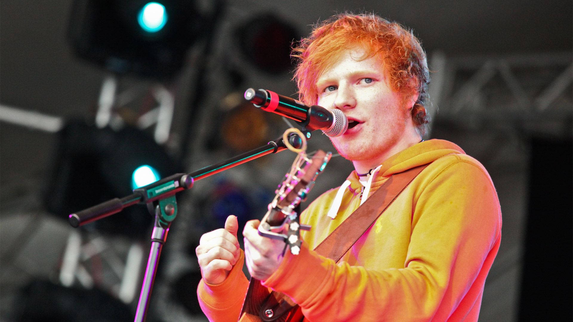 Ed Sheeran In Orange Jacket