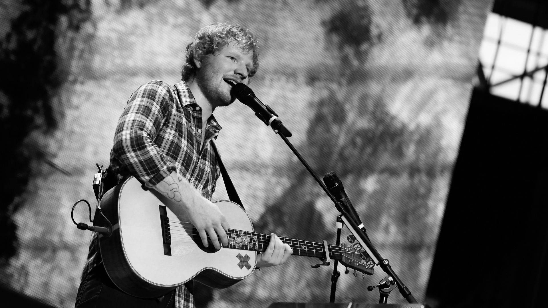 Ed Sheeran Singing On Stage Background