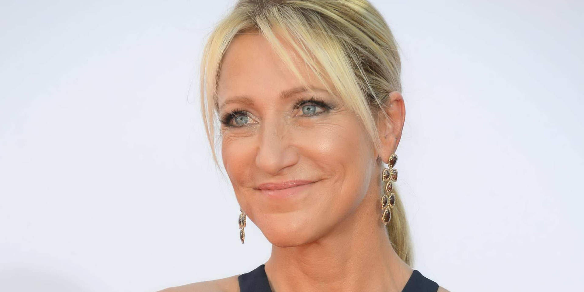 Award-Winning Actress Edie Falco with Ponytail Hairstyle Wallpaper