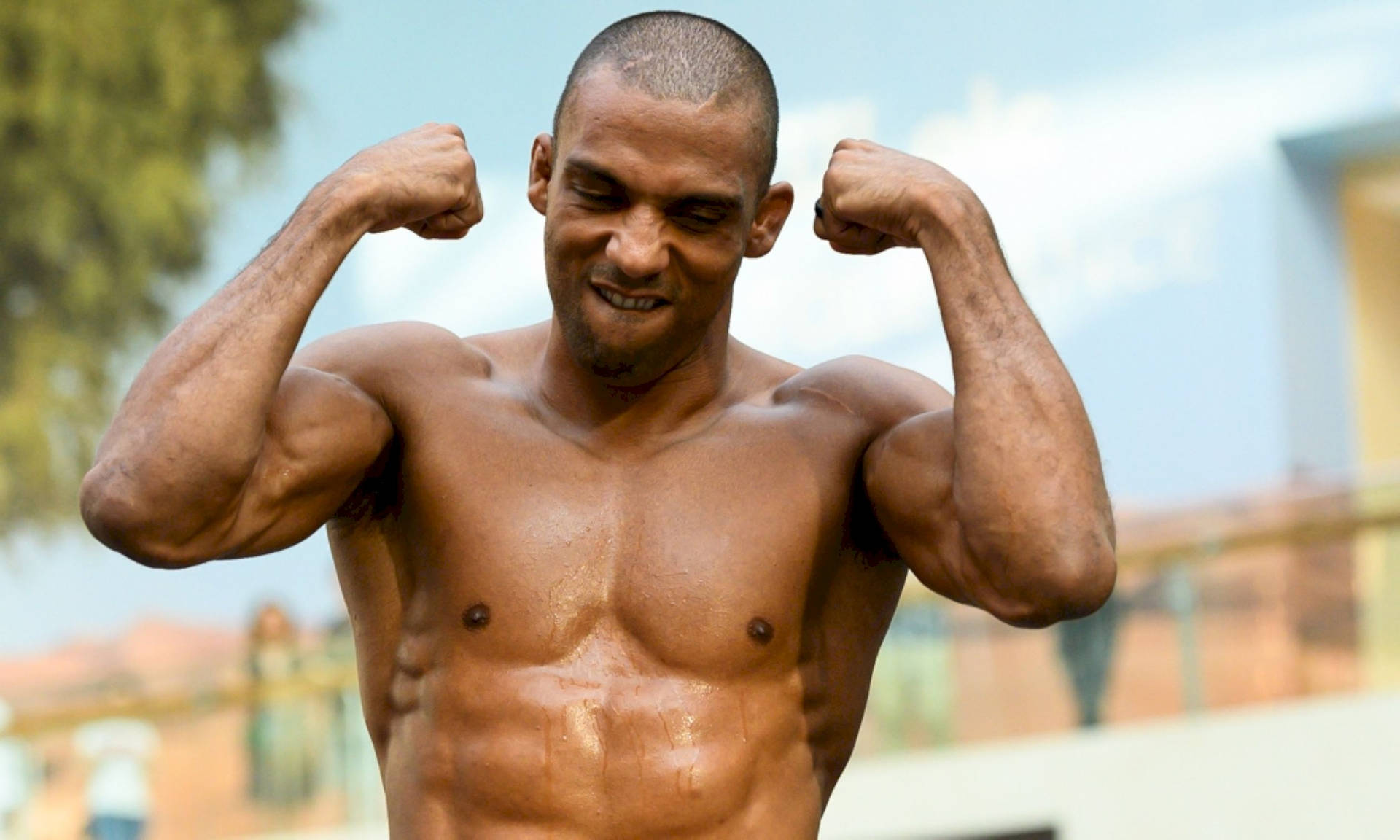 Edson Barboza Gritting His Teeth And Flexing Wallpaper