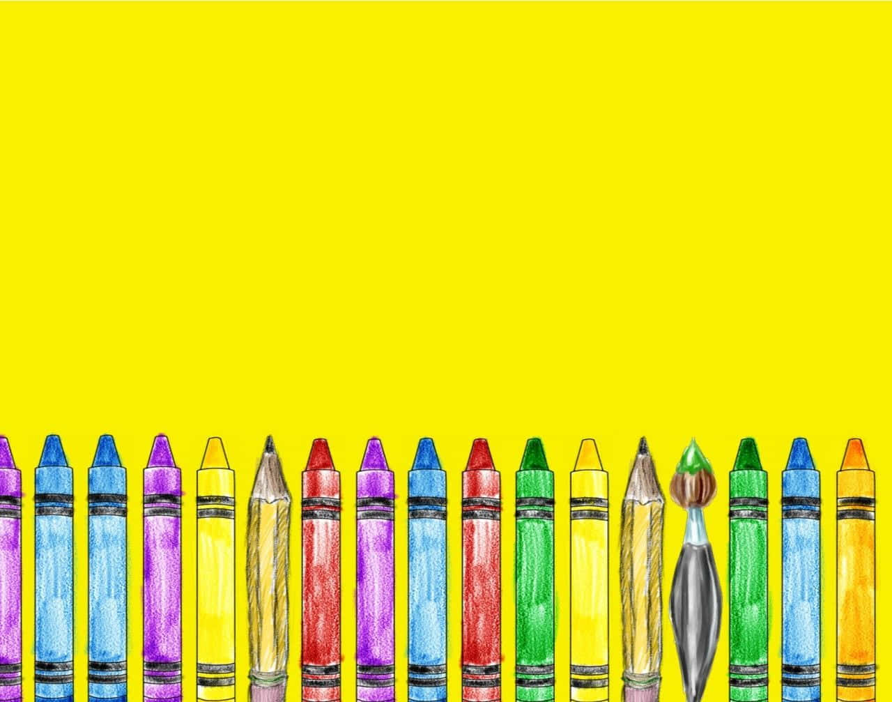 Crayons In A Row On A Yellow Background