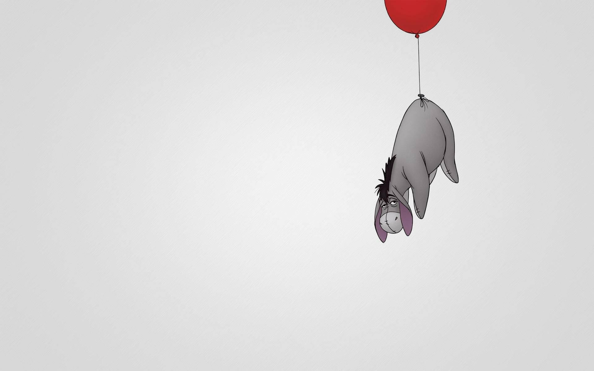 An Upset Eeyore Looking At A Balloon From Winnie The Pooh Wallpaper