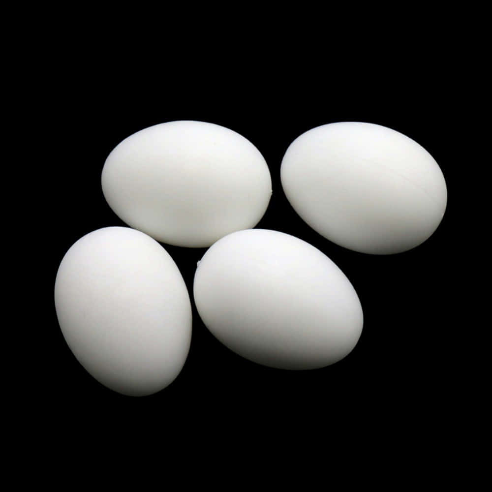 White Eggs On A Black Background