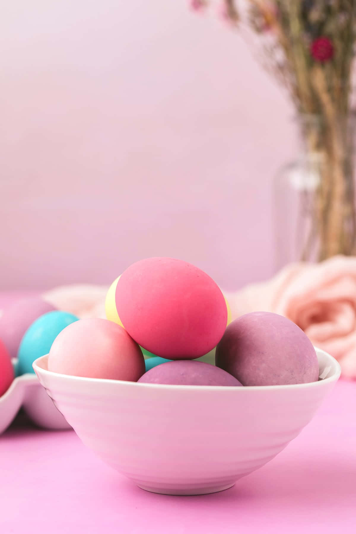 Colorful Easter Eggs In A Bowl On A Pink Background