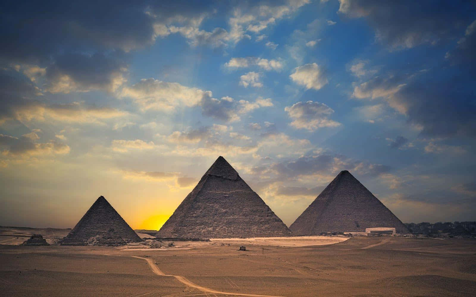 Stunning panoramic view of the Pyramids of Giza at sunset